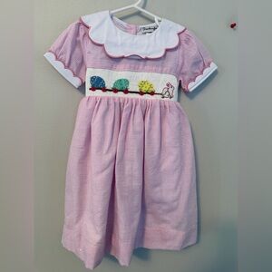 Smockingbird Pink Smocked Dress with Bunny Pulling Easter Eggs